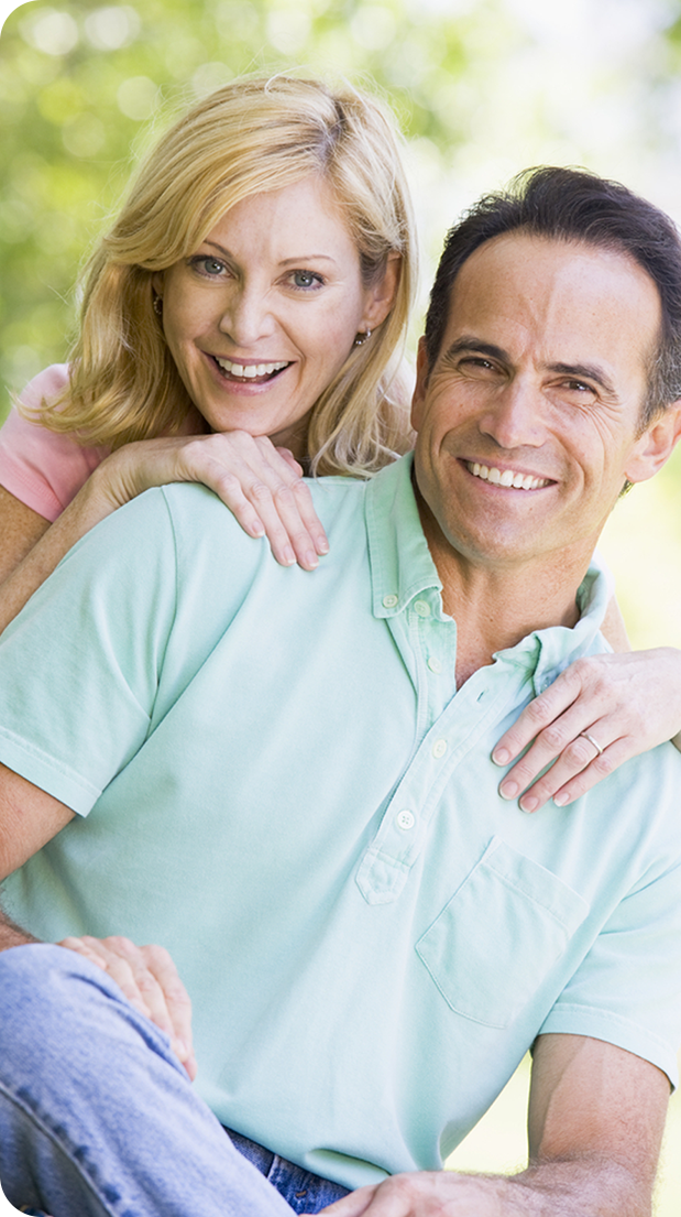 Happy couple smiling outdoors
